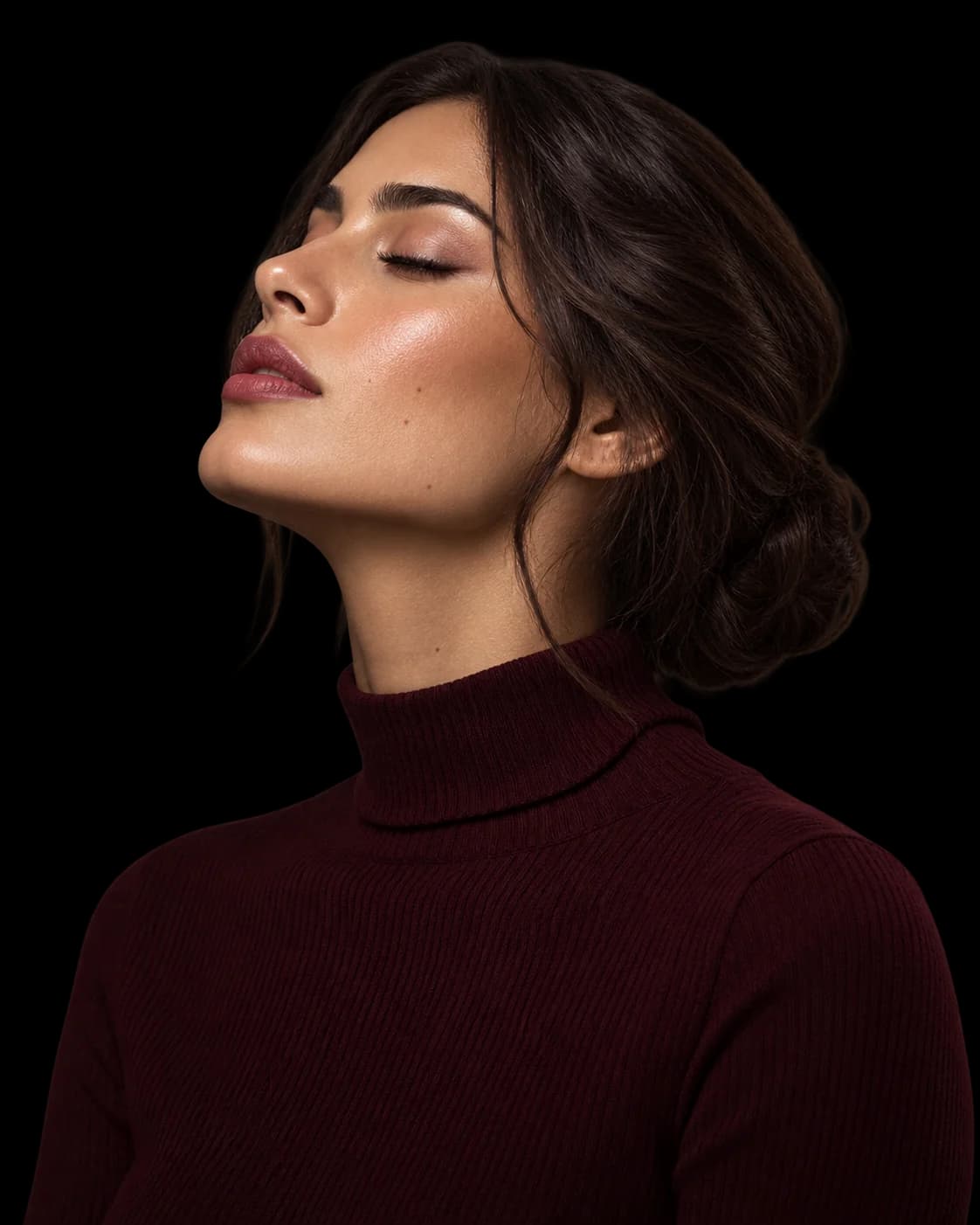 Editorial beauty portrait of a woman with closed eyes, her face turned toward the light